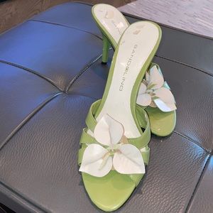Women’s heels. Green and cream flower petals.